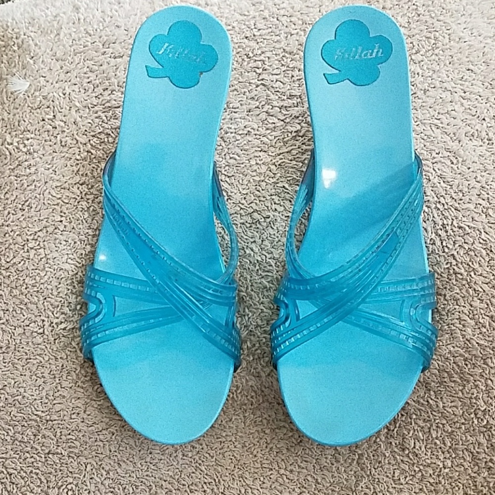 Slip on, low heel sandal.